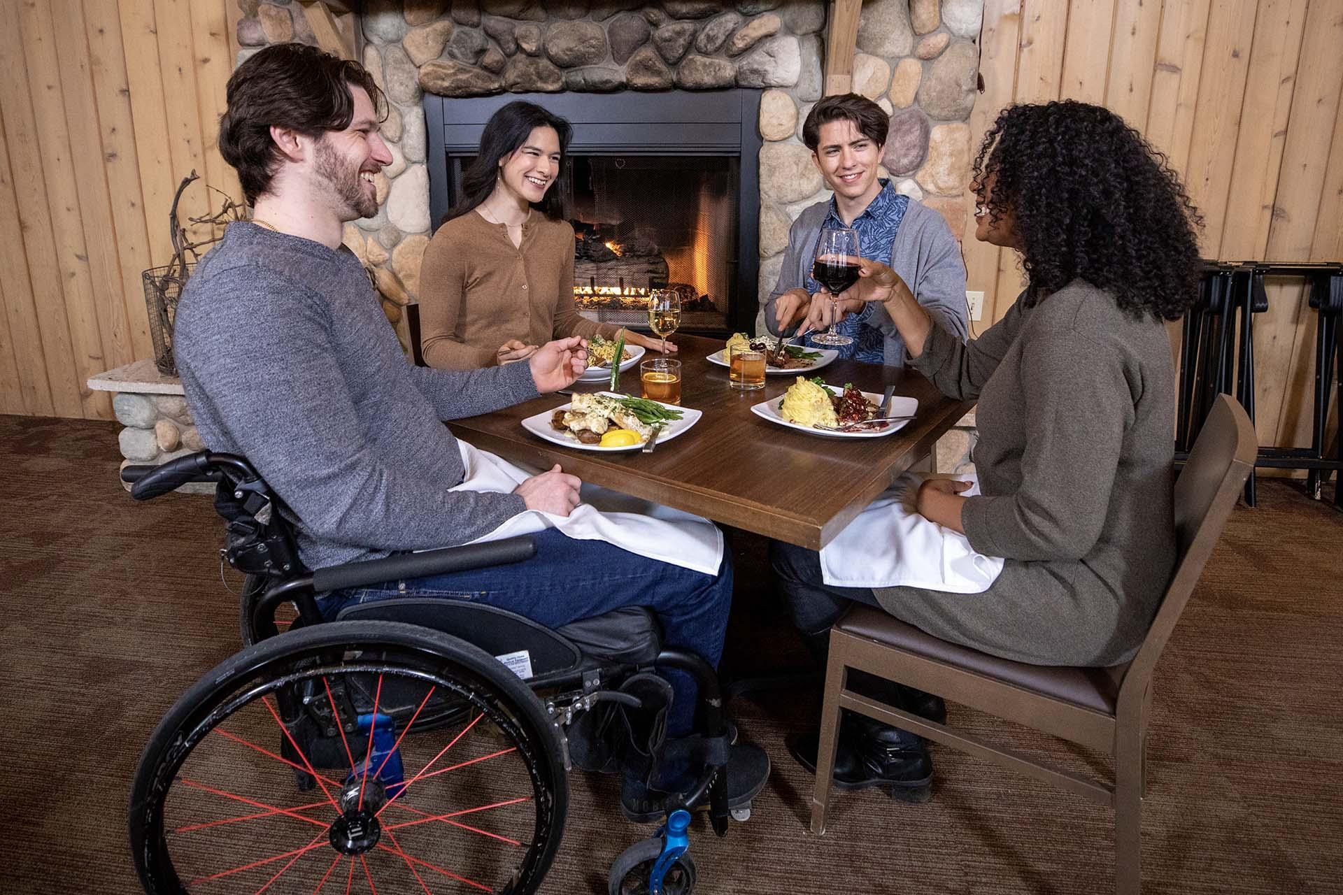 A group of friends enjoying a meal at Tabor Hill.