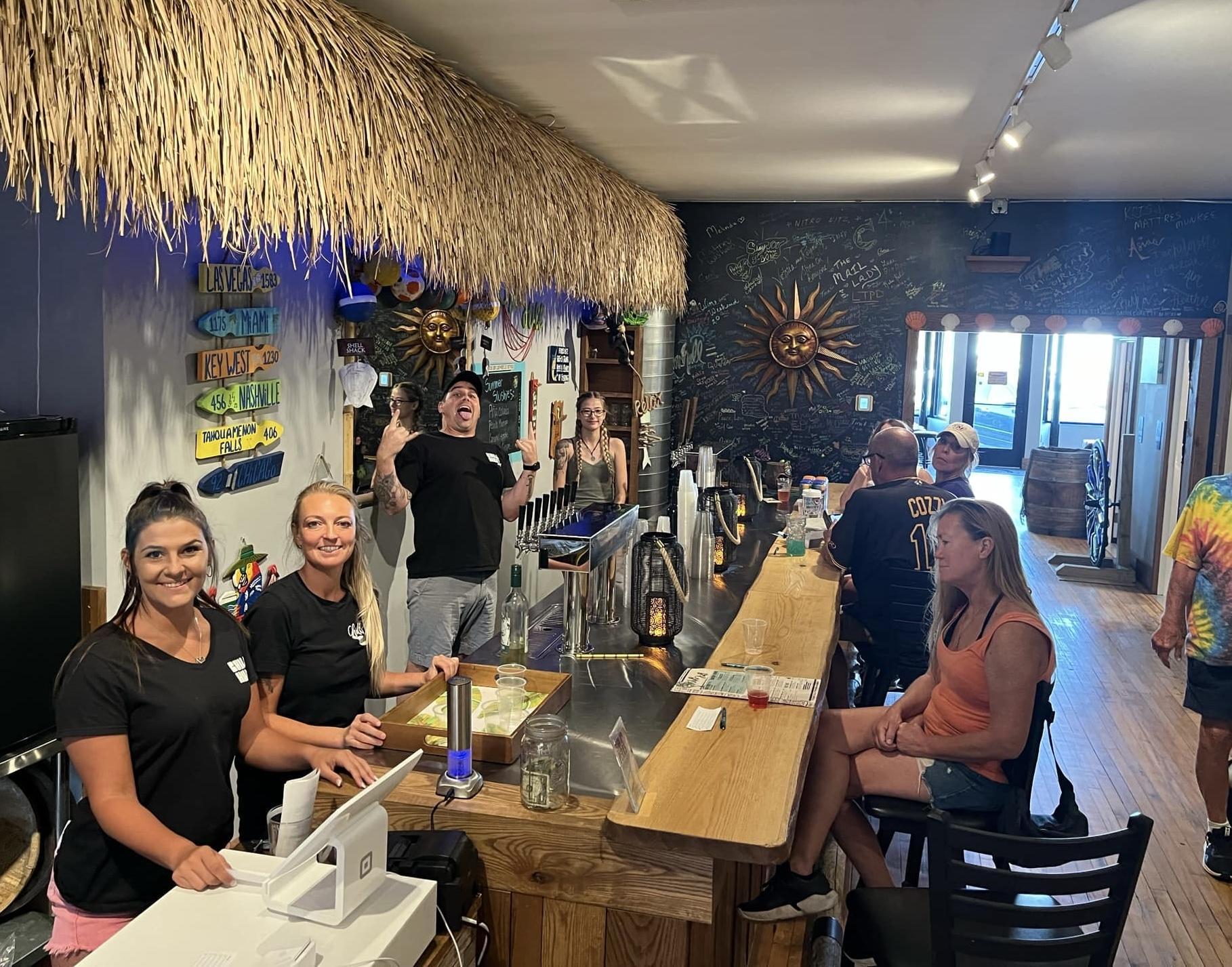 Group photo of staff at the back bar