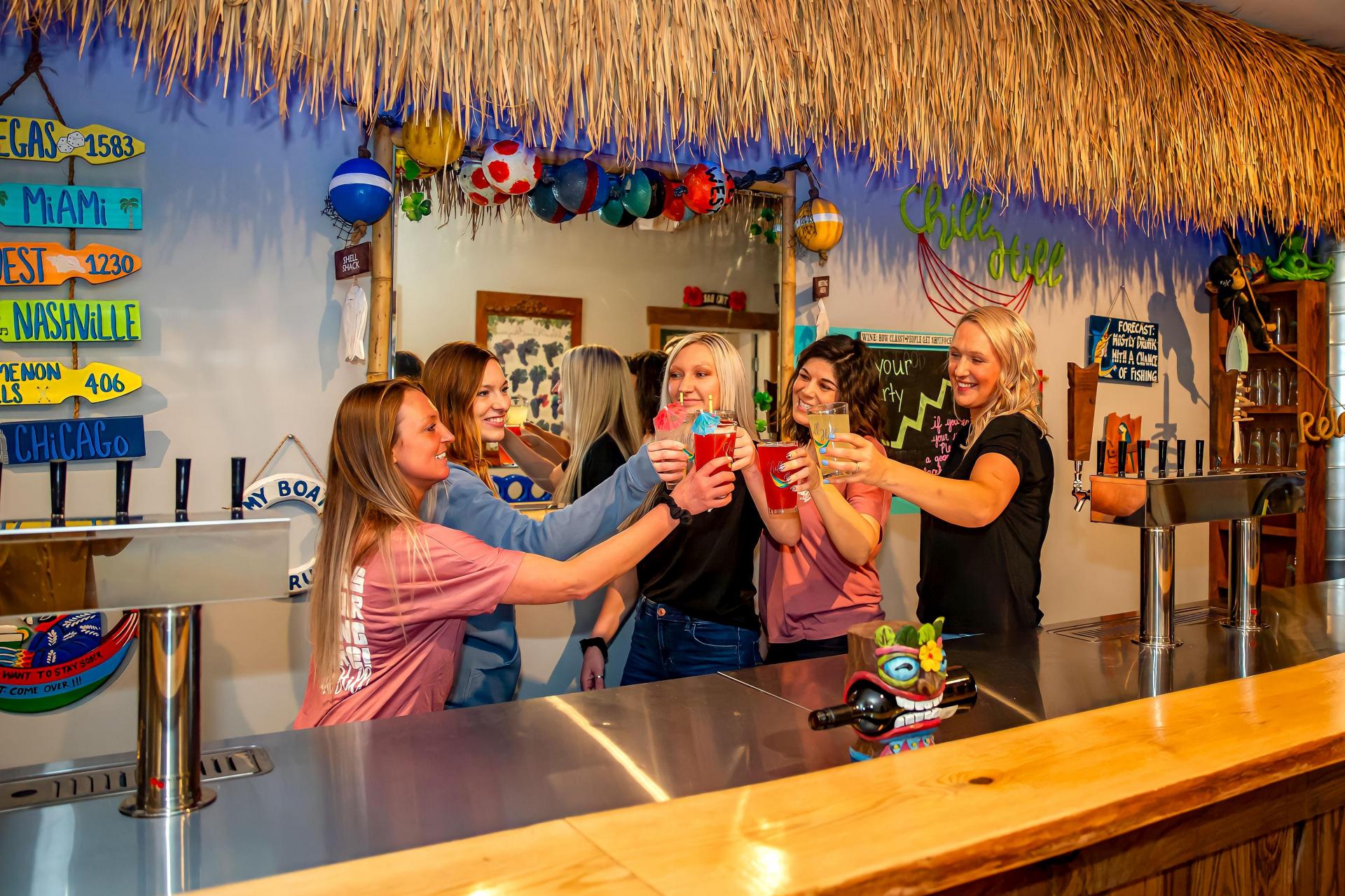 Staff cheers group photo at the back bar