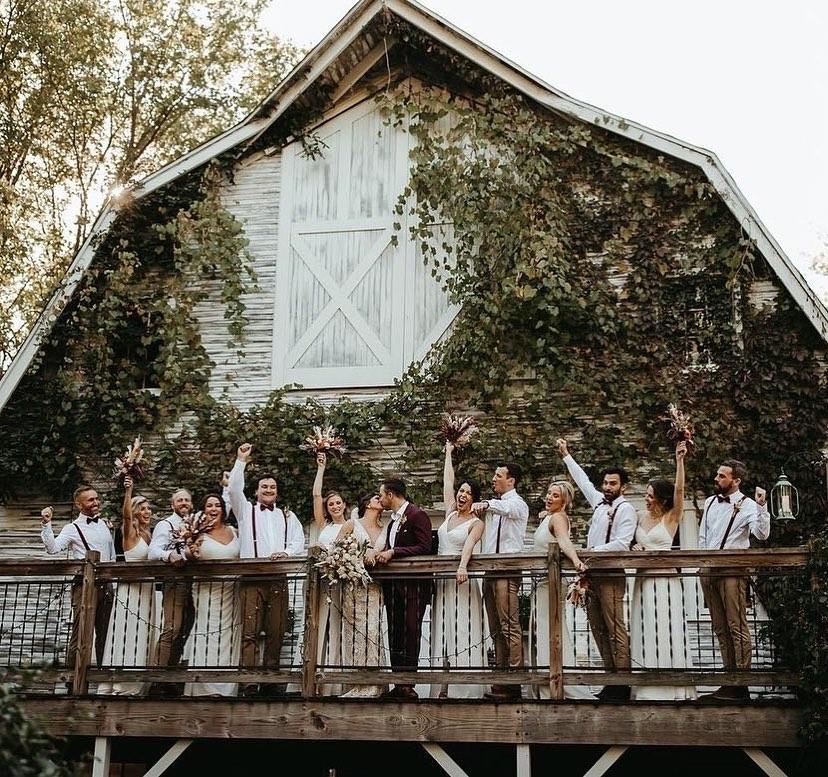 A wedding party celebrating together at Blue Dress Barn.
