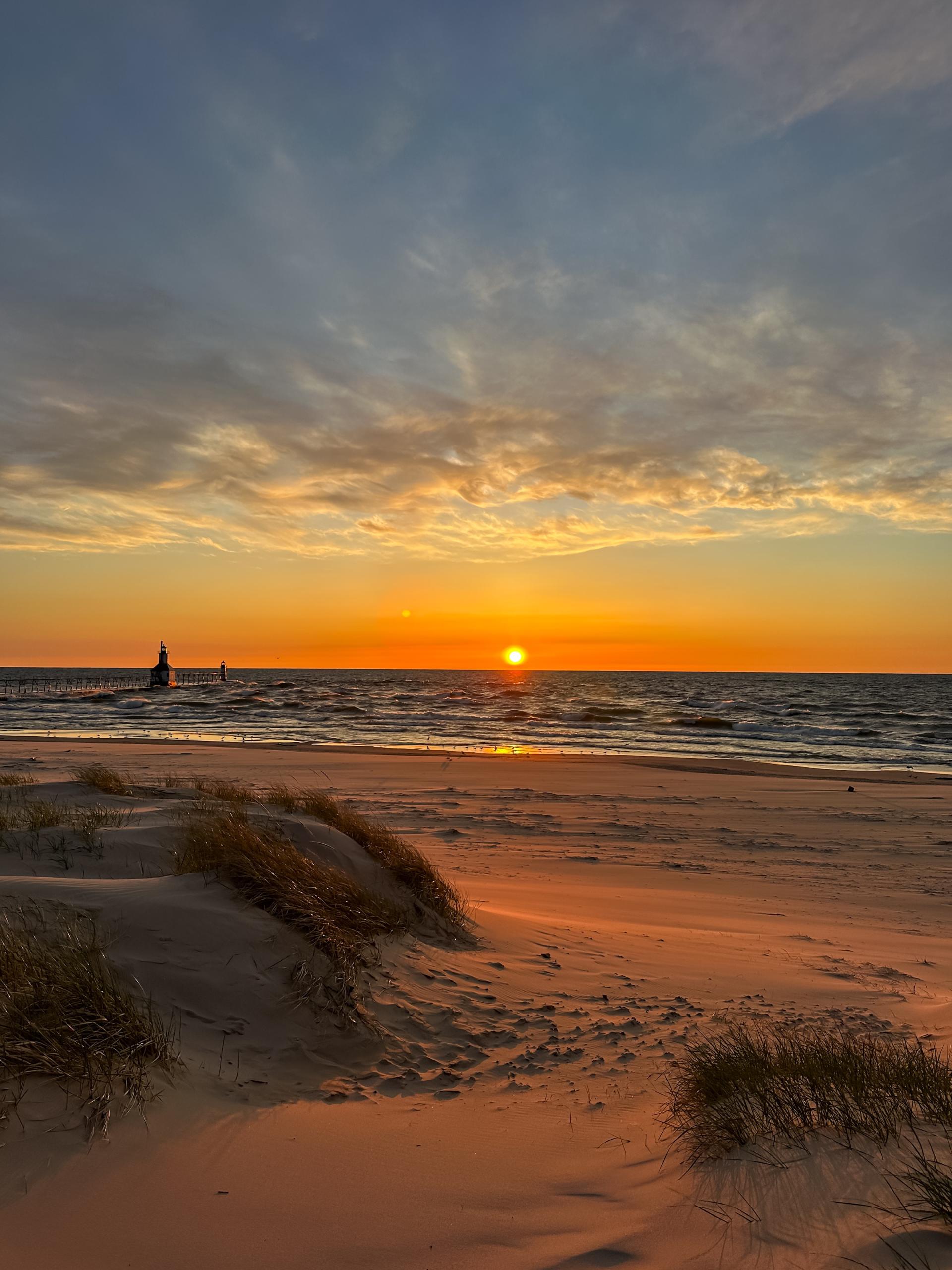 Sunset at Tiscornia Park with the lighthouse in the distance.