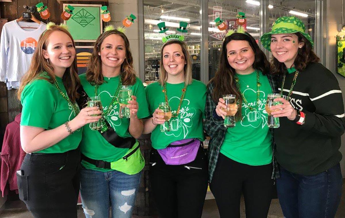 Five women wearing green St. Patrick