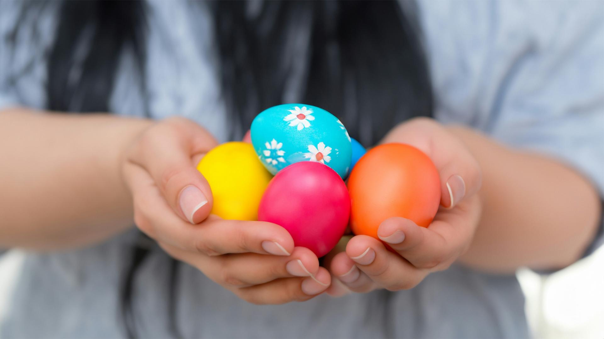 a child holding Easter eggs.