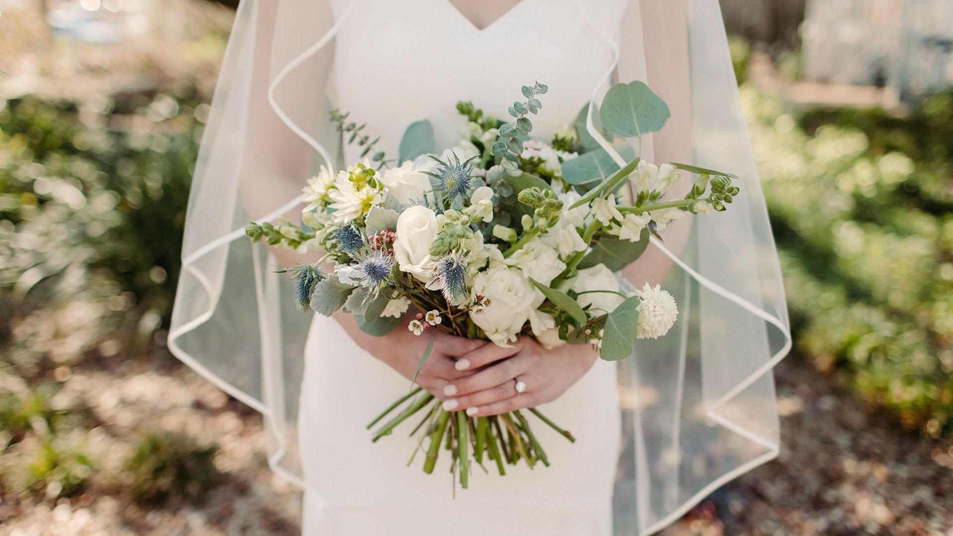 A bride holding a bouquet.